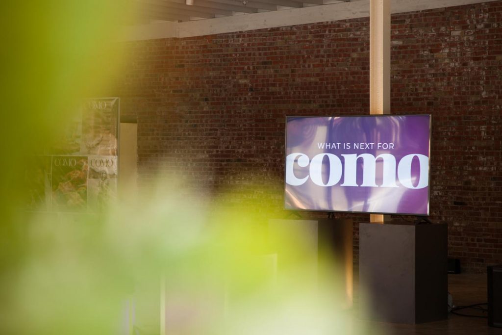 TV at COMO Magazine launch event saying "What's next for como"